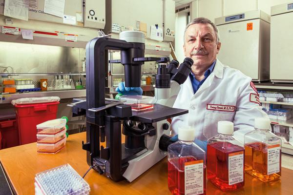 Dr. Tomasz Skorski works in his lab