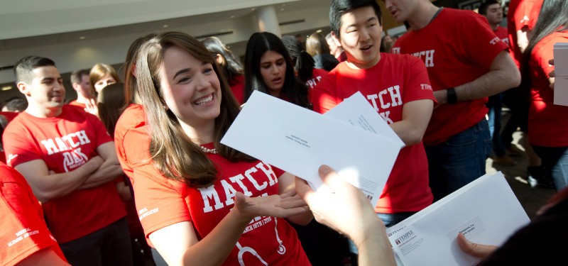 A fourth-year medical student receives her residency match letter at match day in 2016.