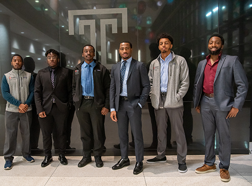 six young black men in front of the Temple T