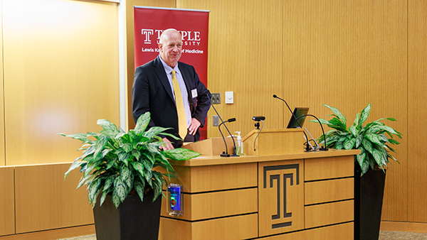 a male doctor giving a speech