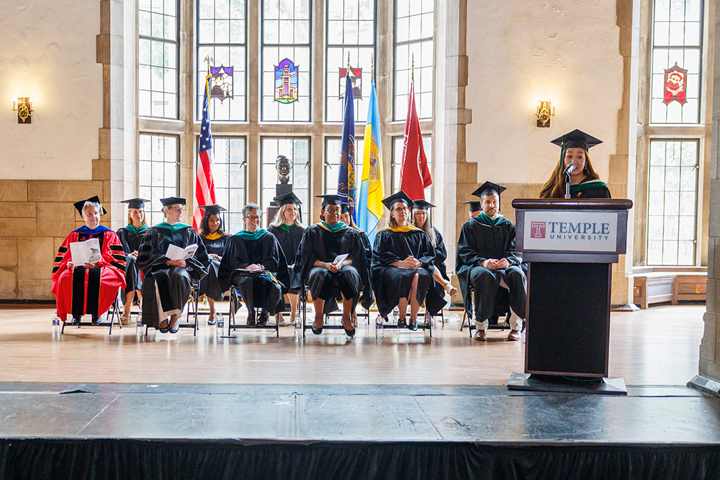 class president Samantha Lam, MMS speaking at the podium at the Physician Assistant Program graduation