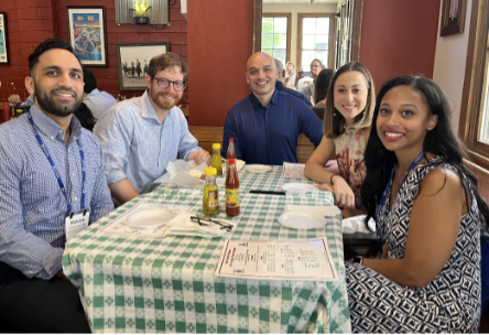 2023-24 chief residents seated at a table for a meal