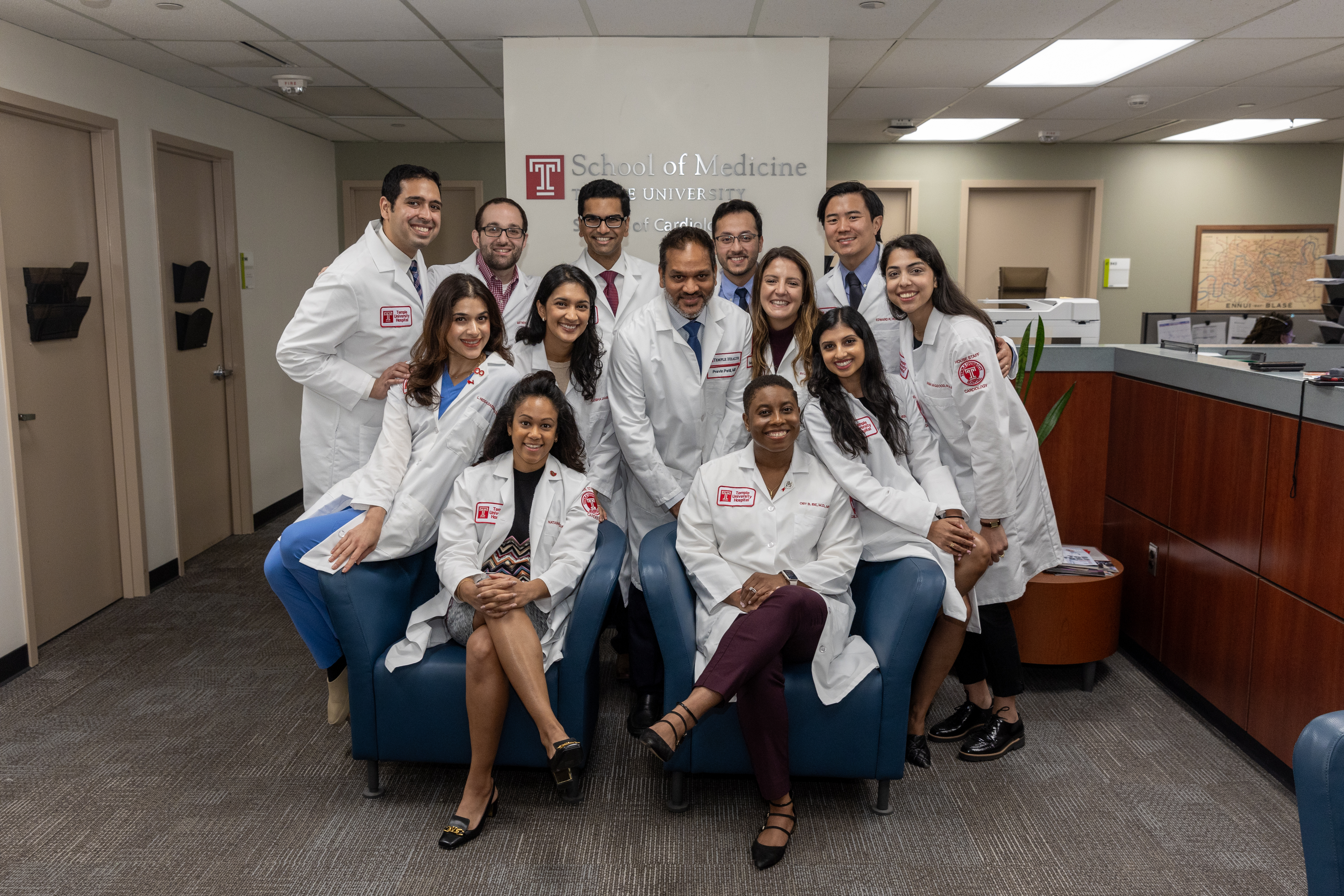Members of the Cardiology Group in white coats, smiling
