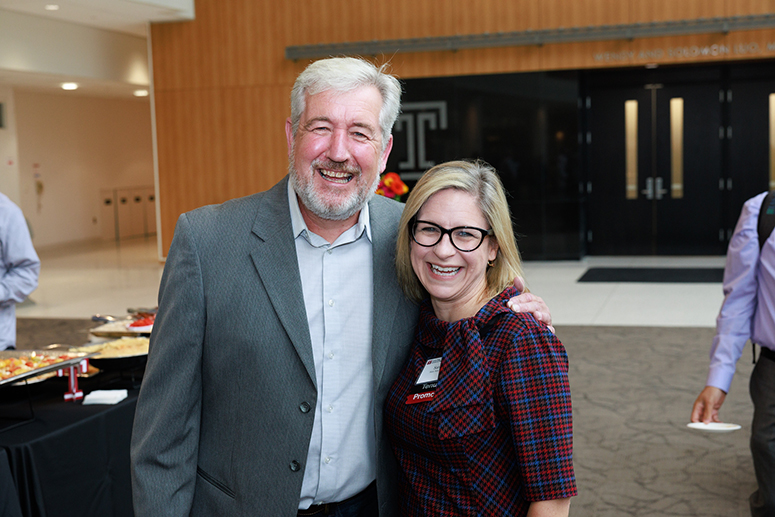 a male faculty member next to a female faculty member