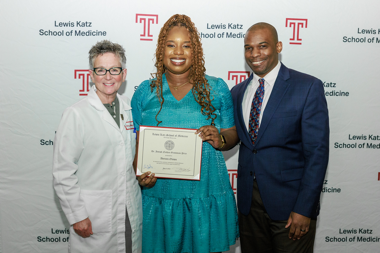 Award recipient Adetutu Olowu with the Dean and another person 