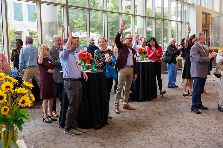 cheering Temple faculty at the event