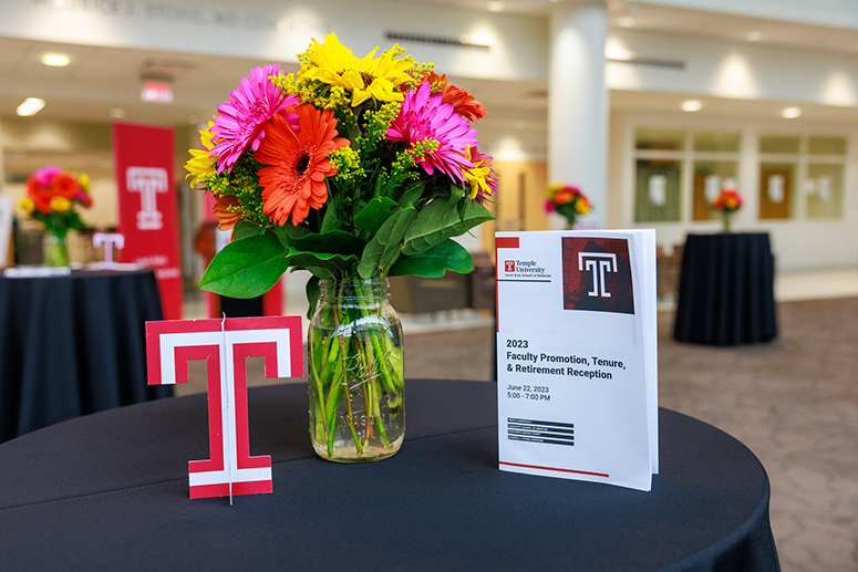 the Temple T, a bouquet of flowers, and a program