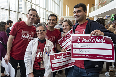 Dr. Amy Goldberg posing with medical students on Match Day 2023