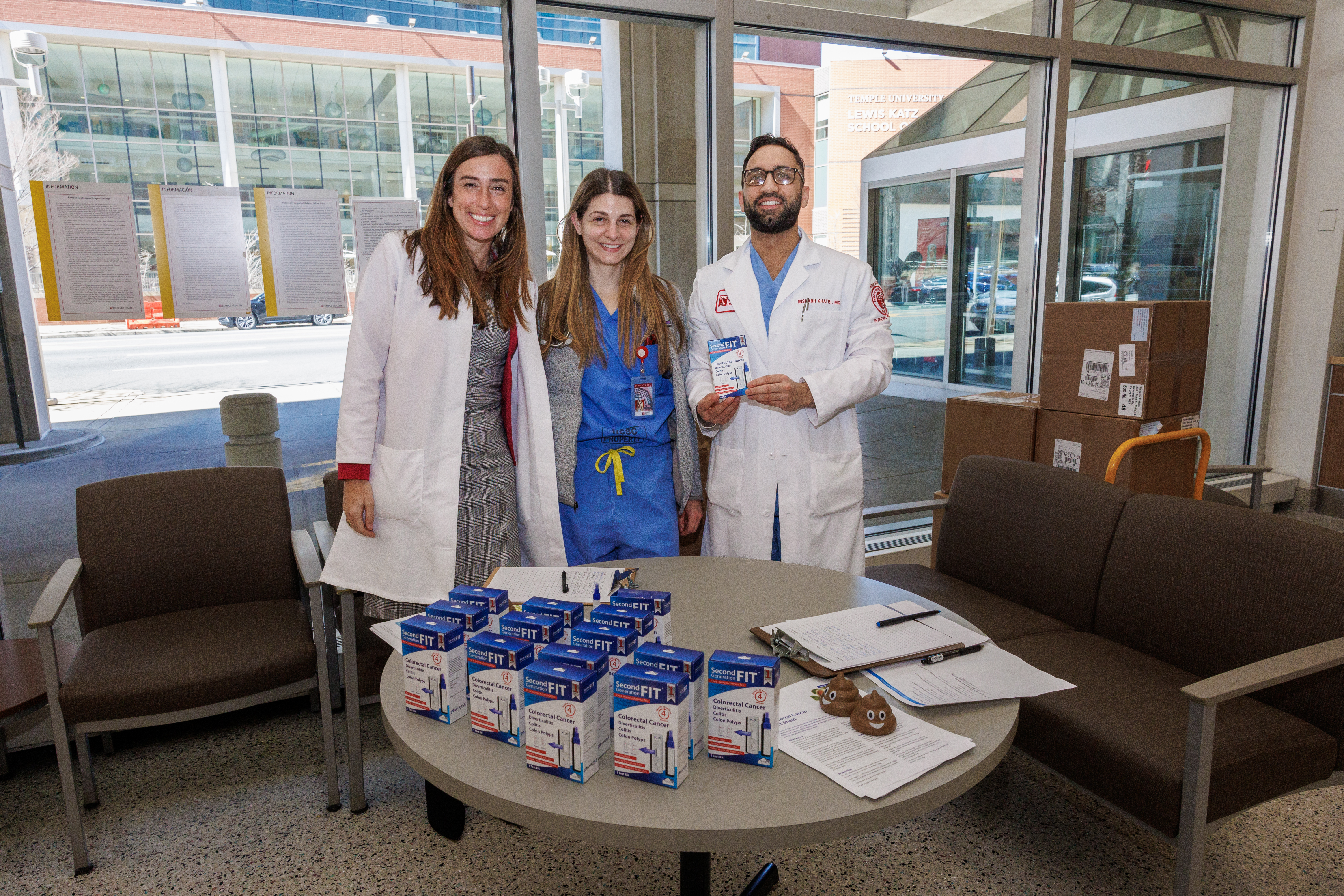 The Temple Health team displays home colorectal cancer screening test kits