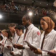 MD Class of 2027 read a statement during their White Coat Ceremony 