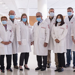 a group of female and male doctors