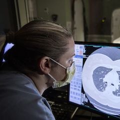 A Temple radiology professional reads a patient scan