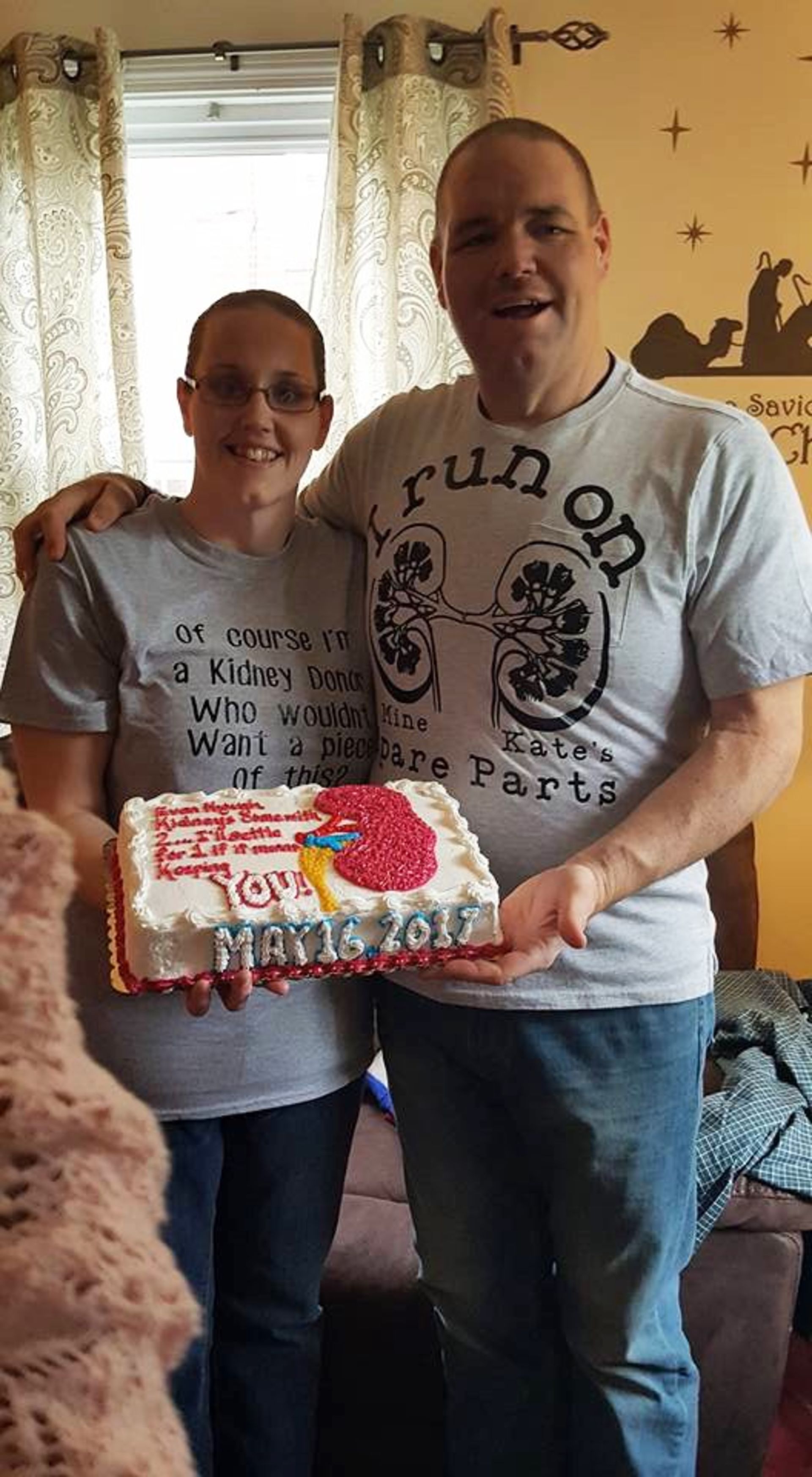 Brother and sister, with a special cake in honor of the kidney donation.
